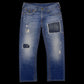 Calça jeans True Religion azul com lavagem desgastada, rasgos e remendos, disponível na garimpo do madruga, tamanho 40.
