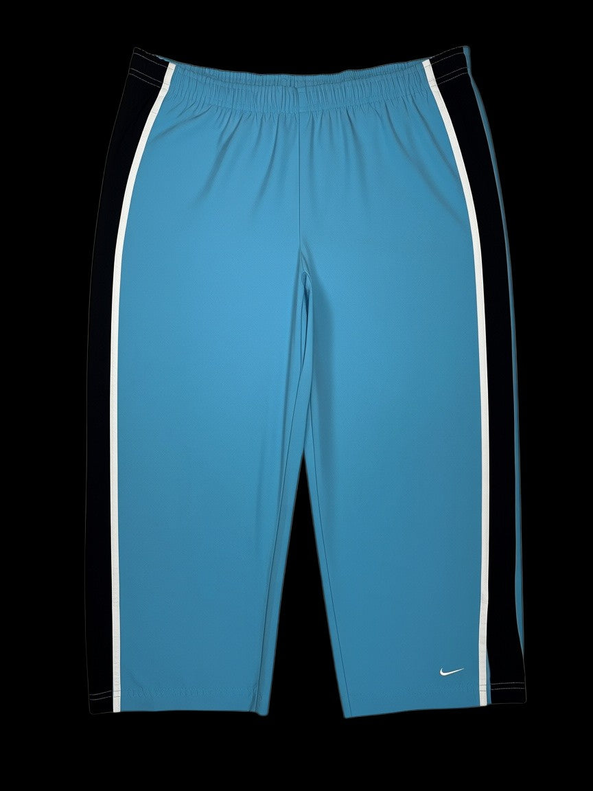 Calça Nike Vintage azul com listras laterais pretas e brancas, tamanho P, disponível na garimpo do madruga.