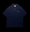 Camisa polo masculina azul marinho da Lacoste em algodão, tamanho G, com logo do crocodilo verde bordado no peito.