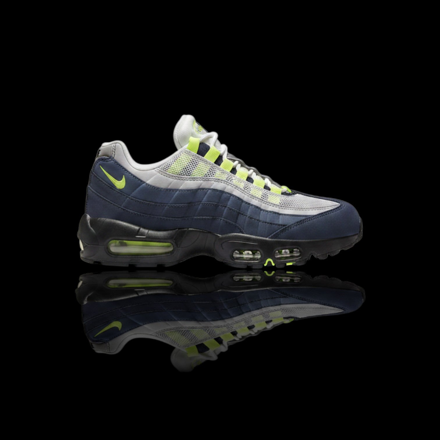 Tênis Nike Air Max 95 OG azul marinho com detalhes em cinza e verde neon, solado preto com amortecimento Air visível.