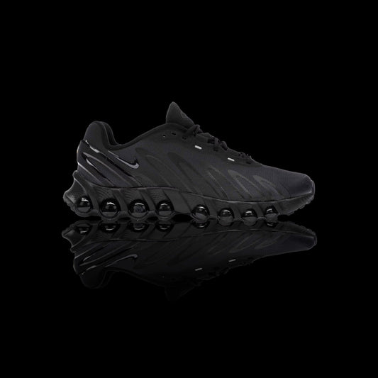 Tênis Nike Air Max Dn8 preto em mesh e solado com bolhas de ar, logo Nike lateral.